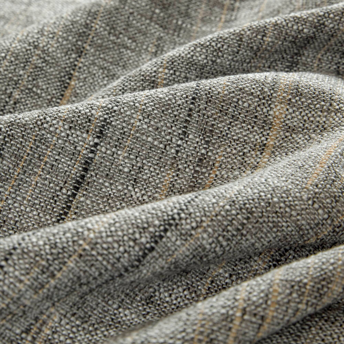 Grey textured jacquard comforter set arranged with geometric decorative pillows