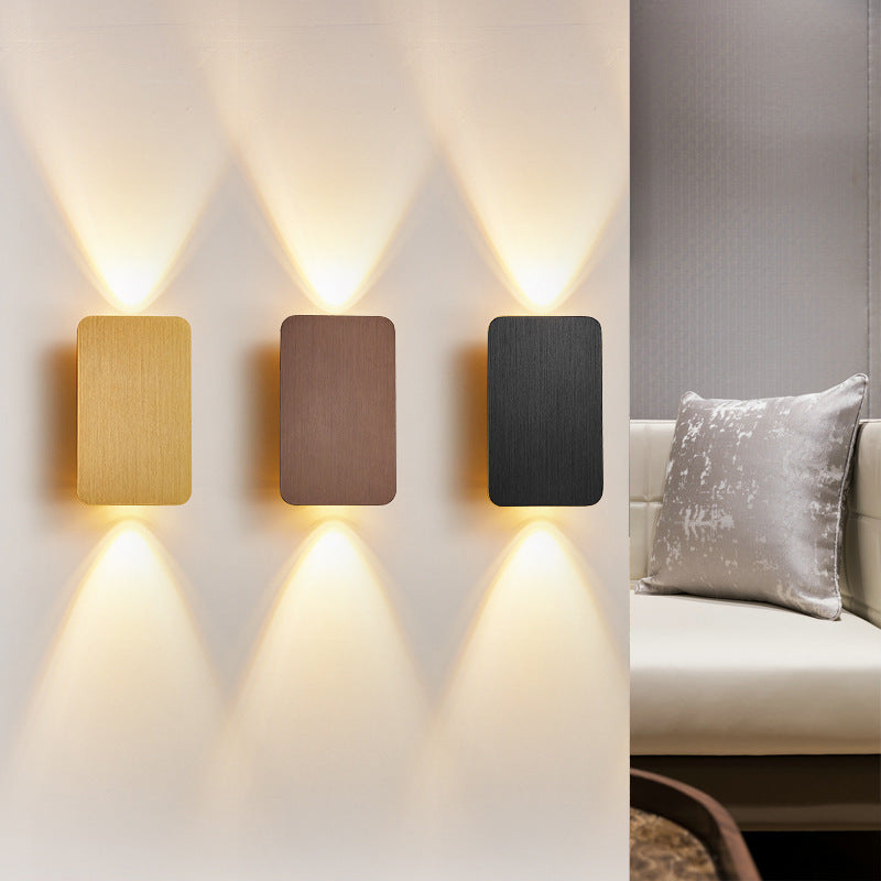 Rectangular indoor wall lamp casting warm upward and downward light
