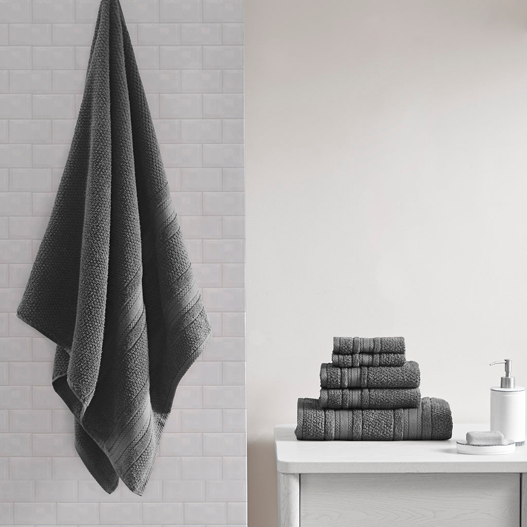 Six-piece textured bath towel set with decorative border detailing