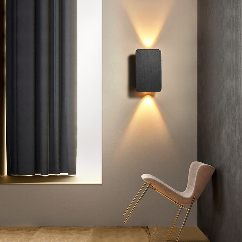 Rectangular indoor wall lamp casting warm upward and downward light