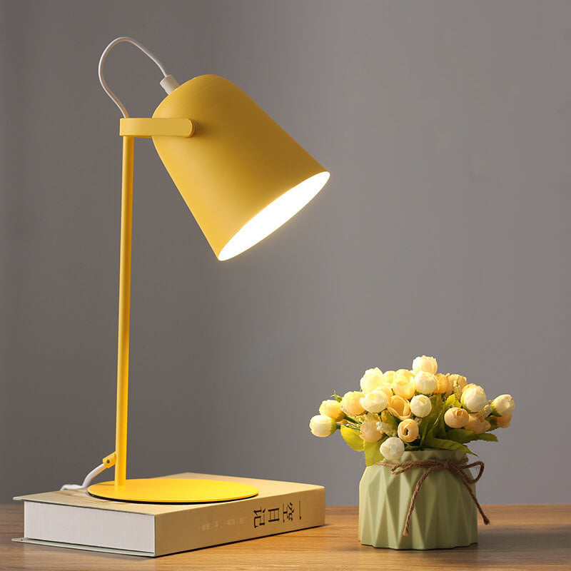 Nordic-style table lamp with angled metal shade, slim stand and round base