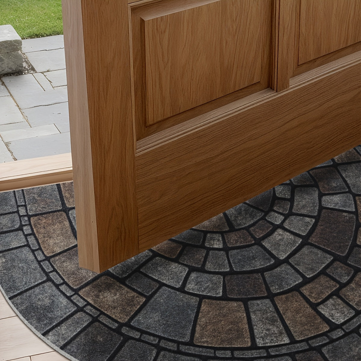 Grey half-circle door mat with geometric mosaic pattern