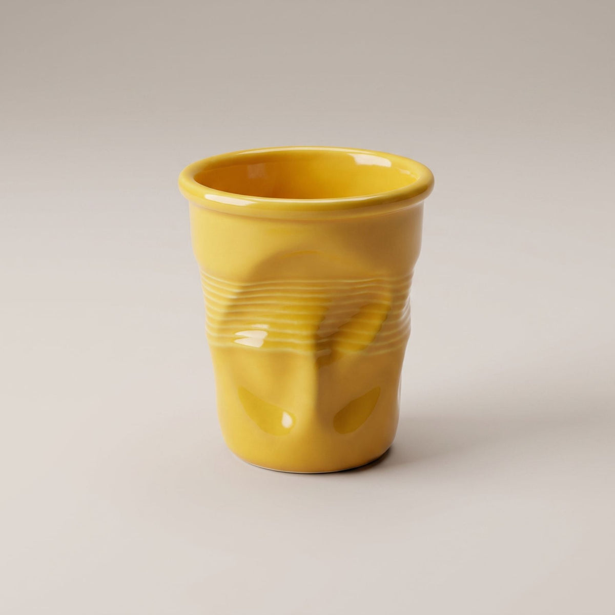 Textured ceramic mug with rounded rim and ribbed body