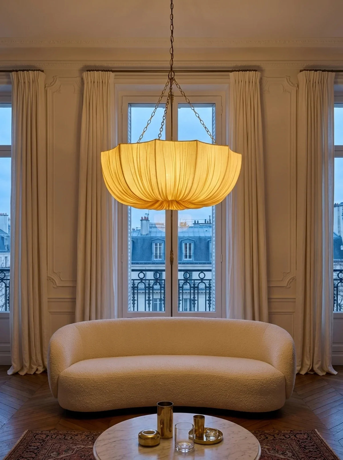 Cream pleated pendant light with dark chain suspension