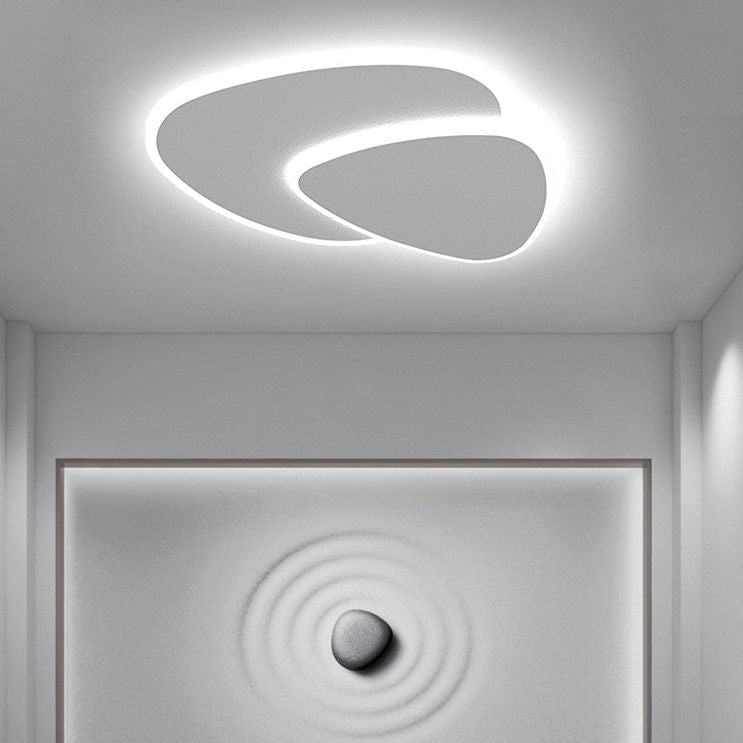 Modern white flush mount ceiling light with two overlapping rounded panels