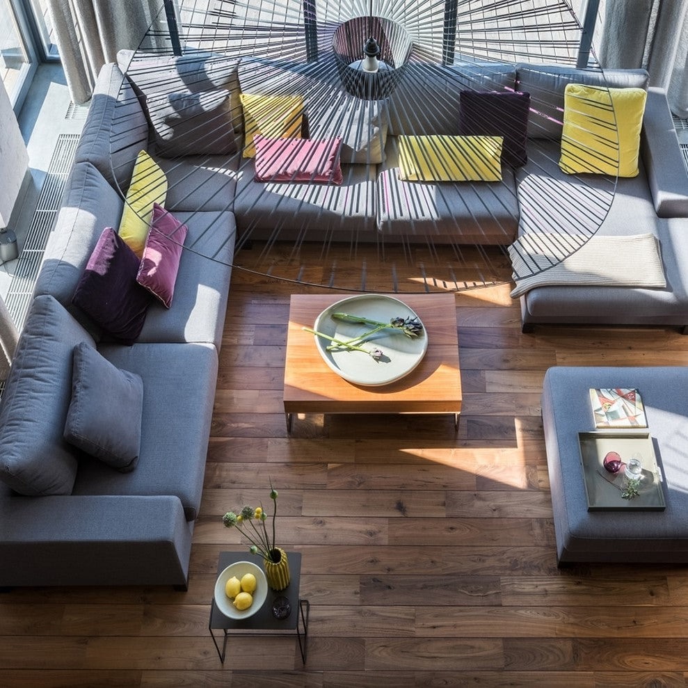 Modern pendant light with a radial wire frame and central cylindrical shade
