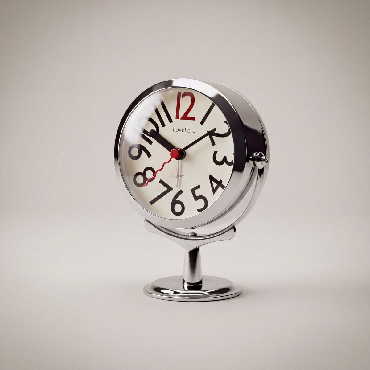 Freestanding analogue alarm clock with bold numbered dial and chrome effect stand