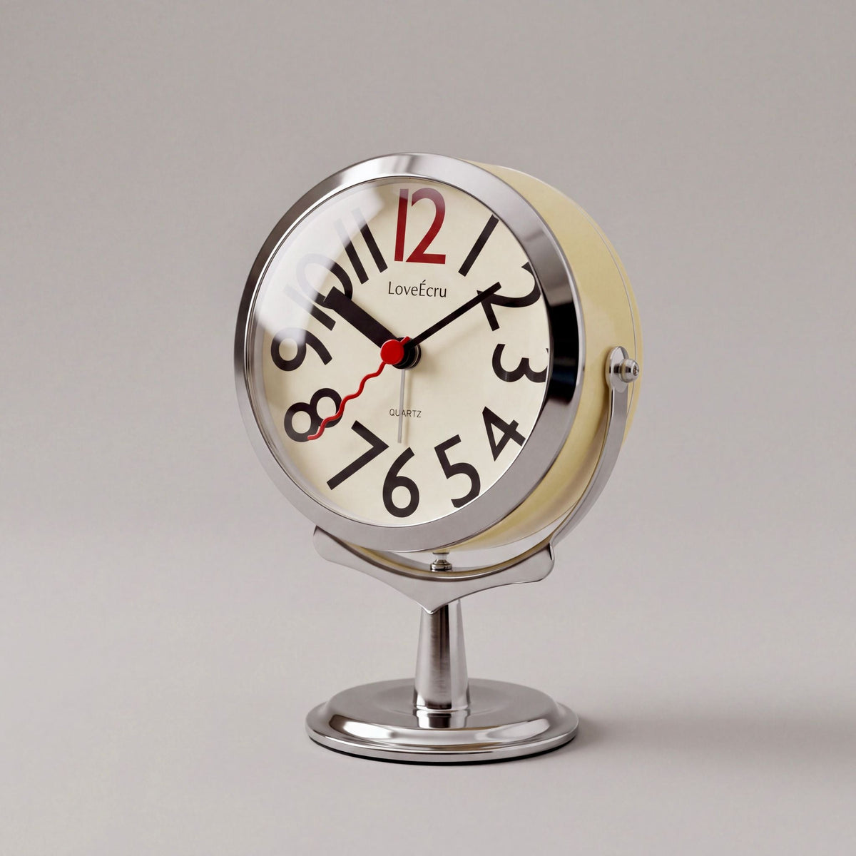 Freestanding analogue alarm clock with bold numbered dial and chrome effect stand