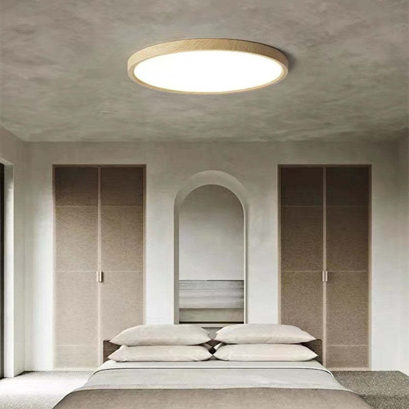 Round dimmable LED ceiling light with a light wood-effect surround