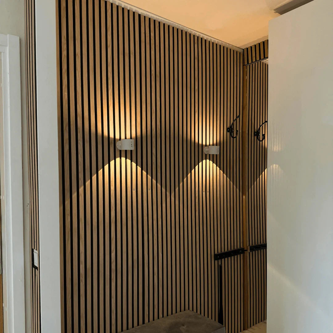 Table lamp with a cylindrical shade, textured reflector, upright stand and round base