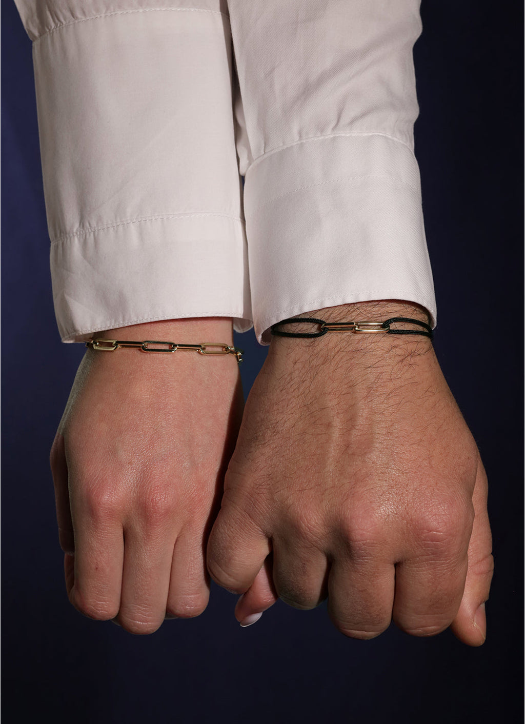 Black cord bracelet with a yellow-gold clasp