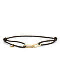 Black cord bracelet with a yellow-gold clasp