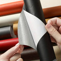 Peel-off repair patch sheet being separated from its white backing