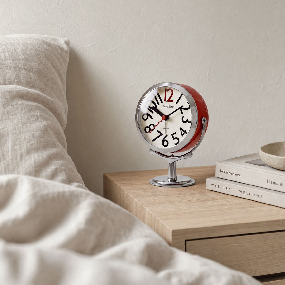 Freestanding analogue alarm clock with bold numbered dial and chrome effect stand