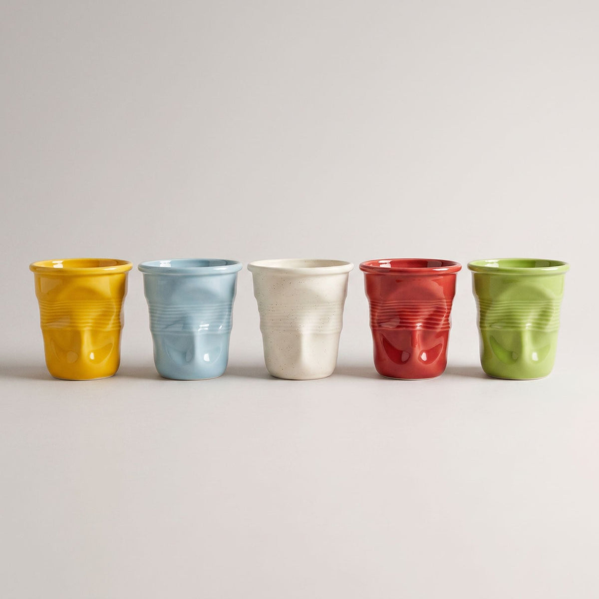 Textured ceramic mug with rounded rim and ribbed body