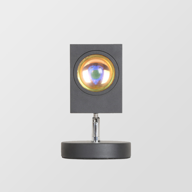 Circular glowing LED table lamp with dark stand and round base