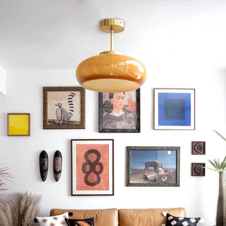 Semi-flush ceiling light with yellow rounded glass shade and brass finish