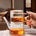 Clear glass teapot with magnetic tea chamber and wood-effect handle