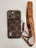 Brown patterned phone case with matching shoulder strap and gold-tone clips