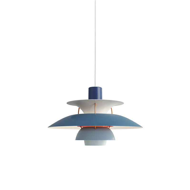 Layered pendant light with overlapping circular shades and hanging cord