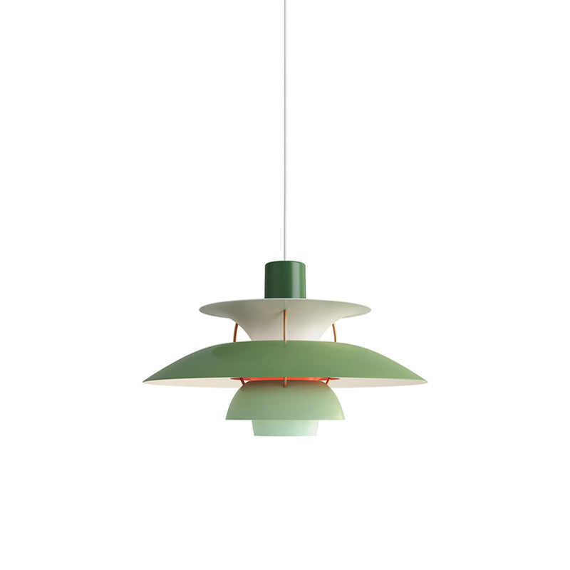 Layered pendant light with overlapping circular shades and hanging cord