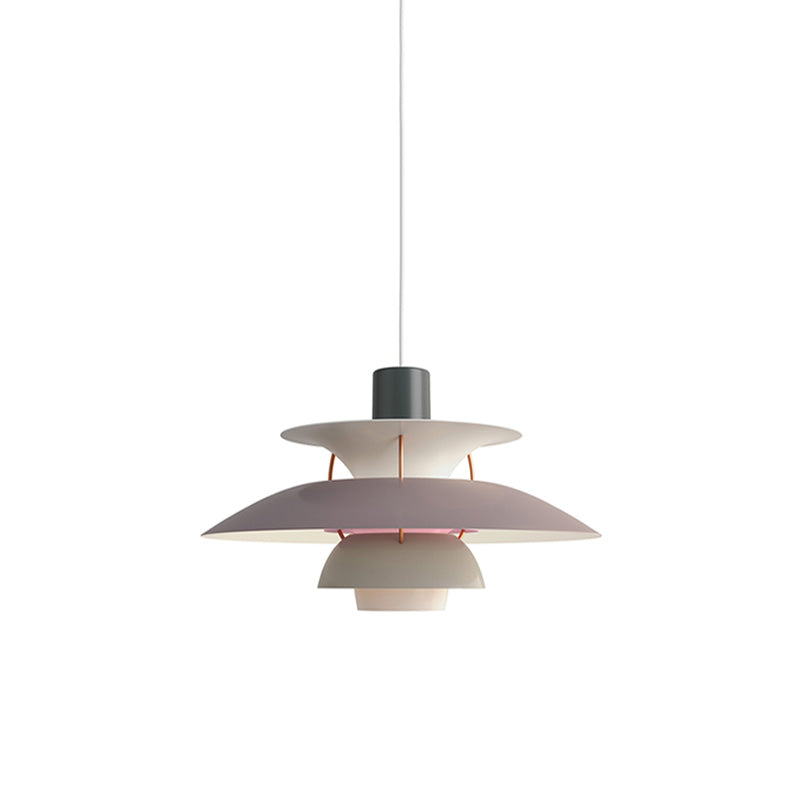 Layered pendant light with overlapping circular shades and hanging cord