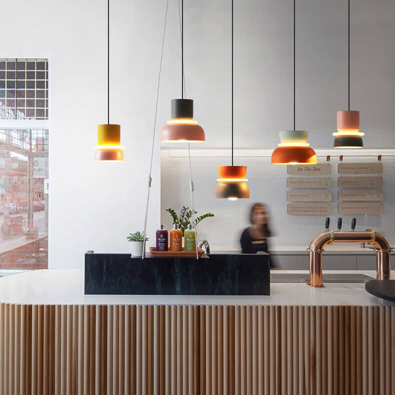 Colourful LED pendant light with a layered rounded shade and hanging cord