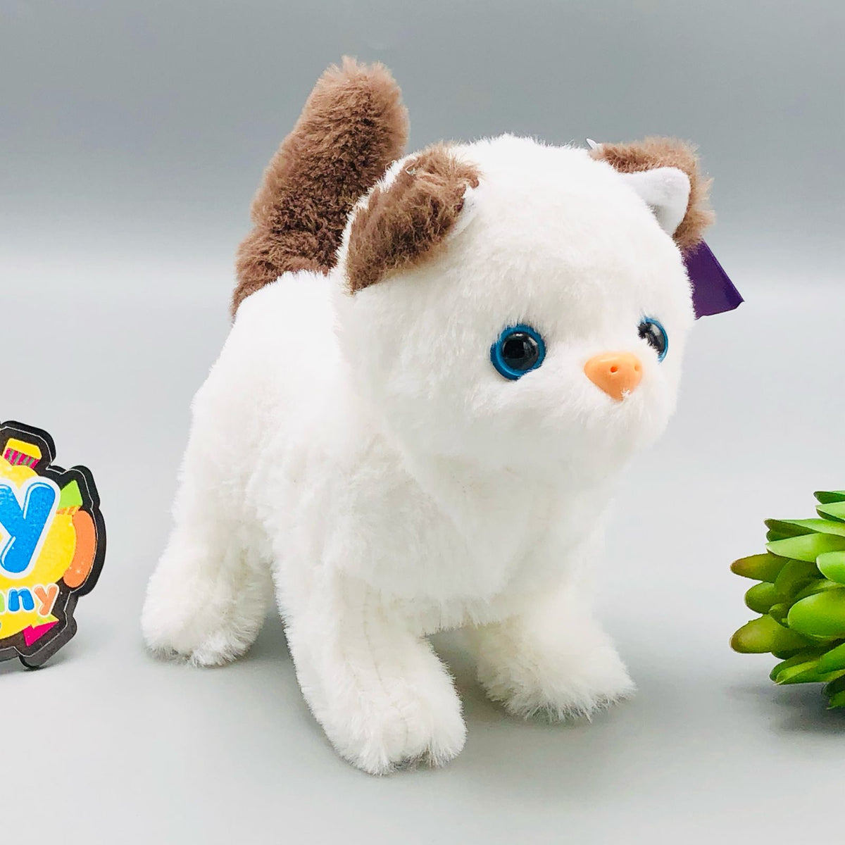 Walking plush cat toy with sound in white and orange colourways
