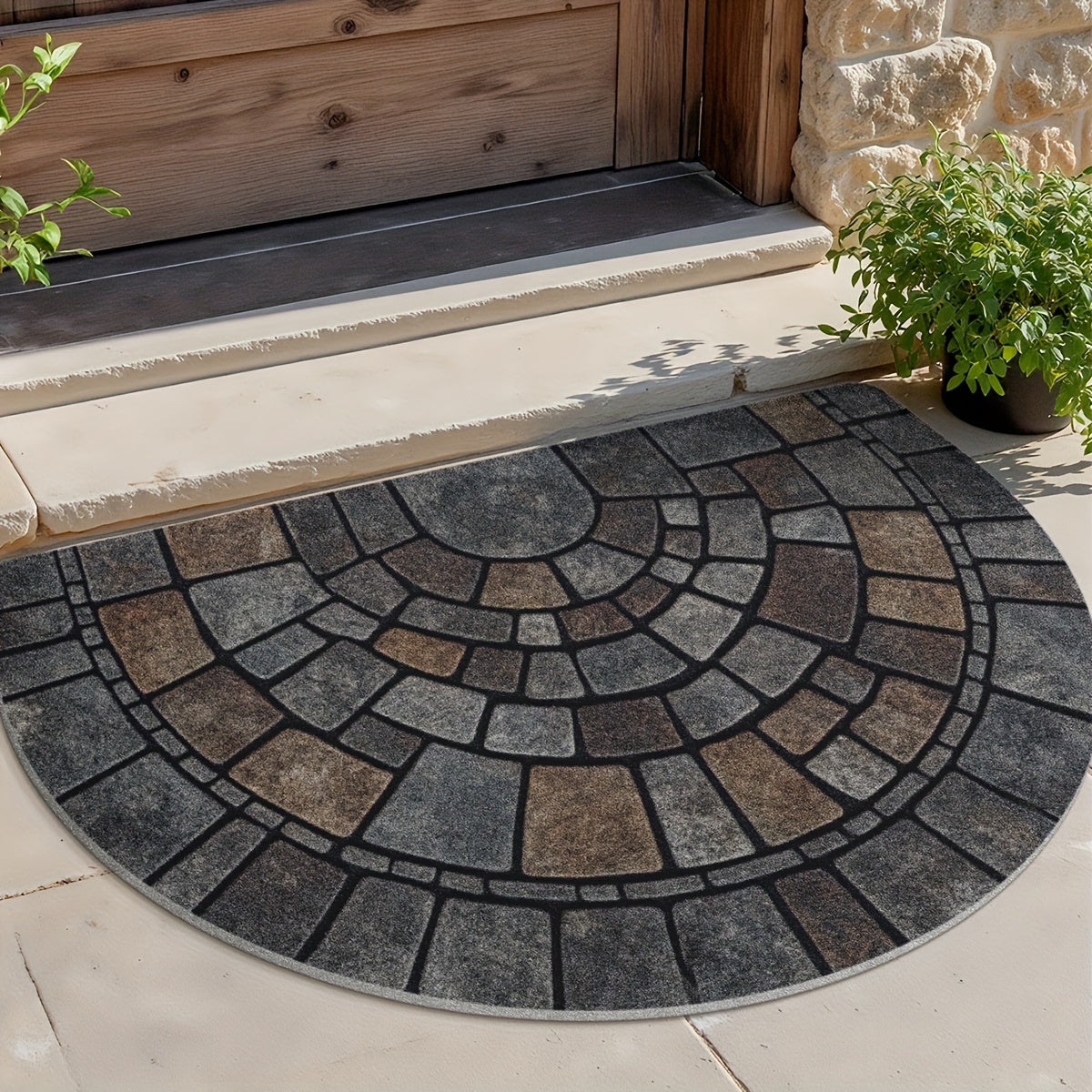 Grey half-circle door mat with geometric mosaic pattern