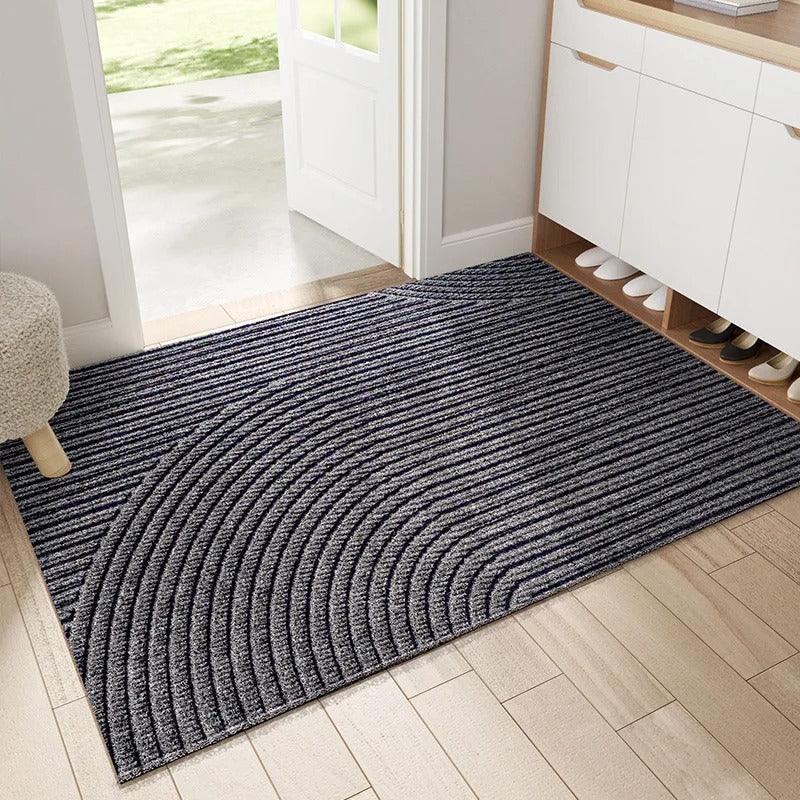 Rectangular geometric ribbed door mat on a hallway floor