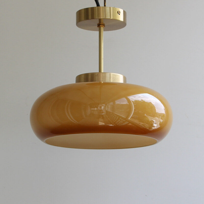 Semi-flush ceiling light with yellow rounded glass shade and brass finish