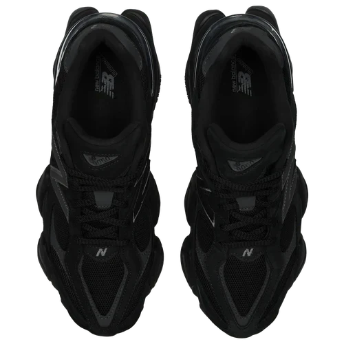 Black low top lace-up trainers with mesh panels and chunky layered soles