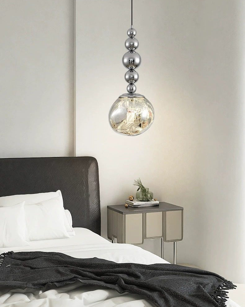 Hanging pendant light with smoked glass shade and silver spherical detailing