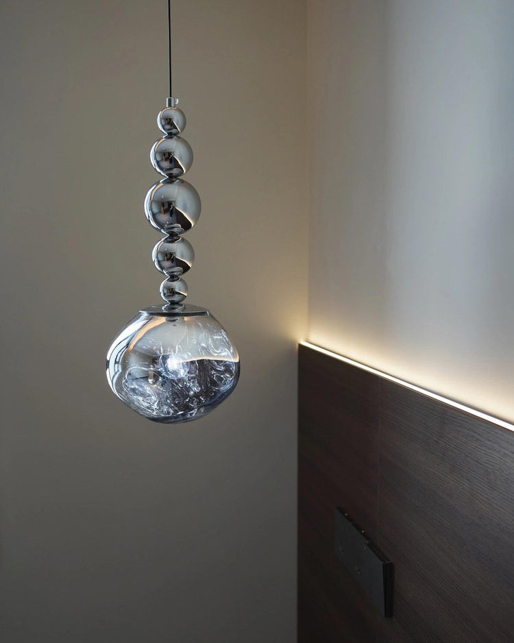 Hanging pendant light with smoked glass shade and silver spherical detailing