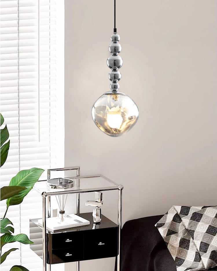 Hanging pendant light with smoked glass shade and silver spherical detailing