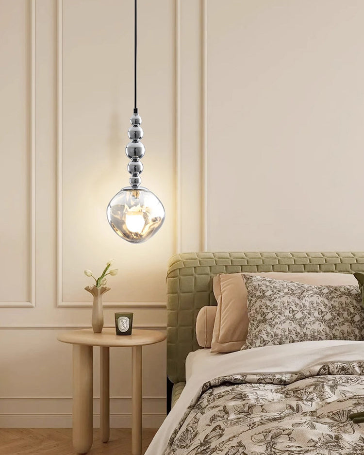 Hanging pendant light with smoked glass shade and silver spherical detailing