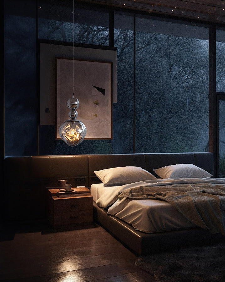Hanging pendant light with smoked glass shade and silver spherical detailing
