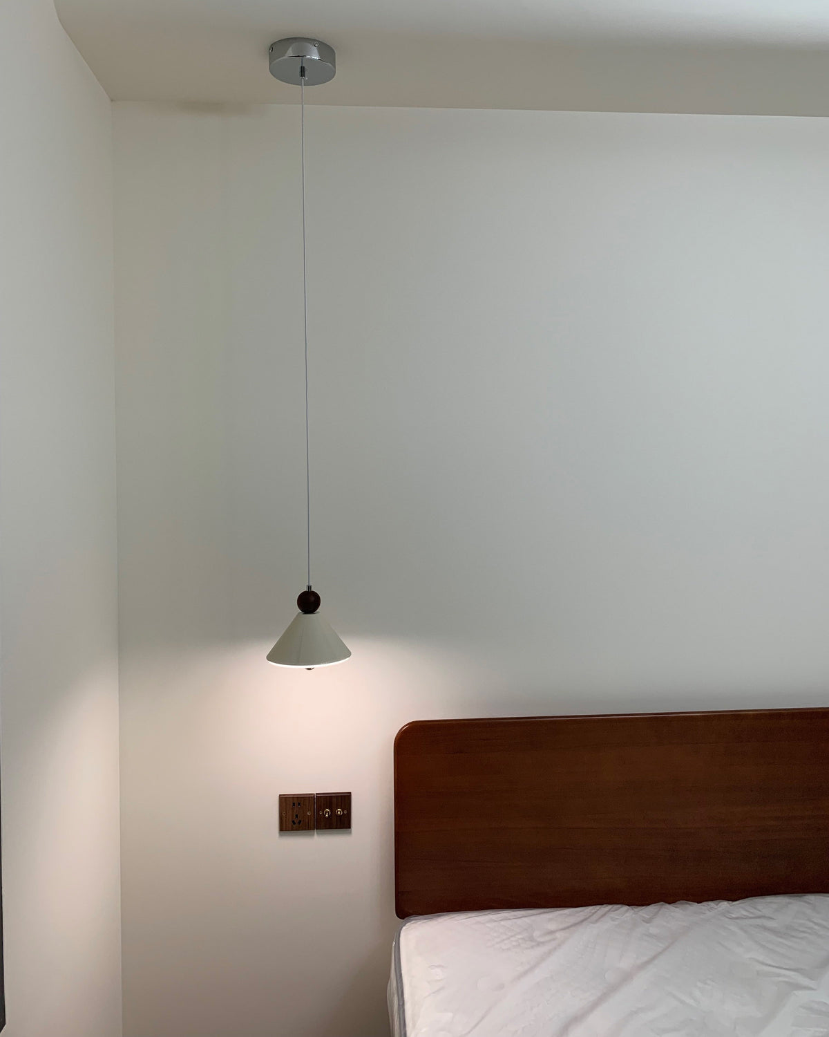 Beige cone pendant light with wooden effect detail and chrome ceiling fitting