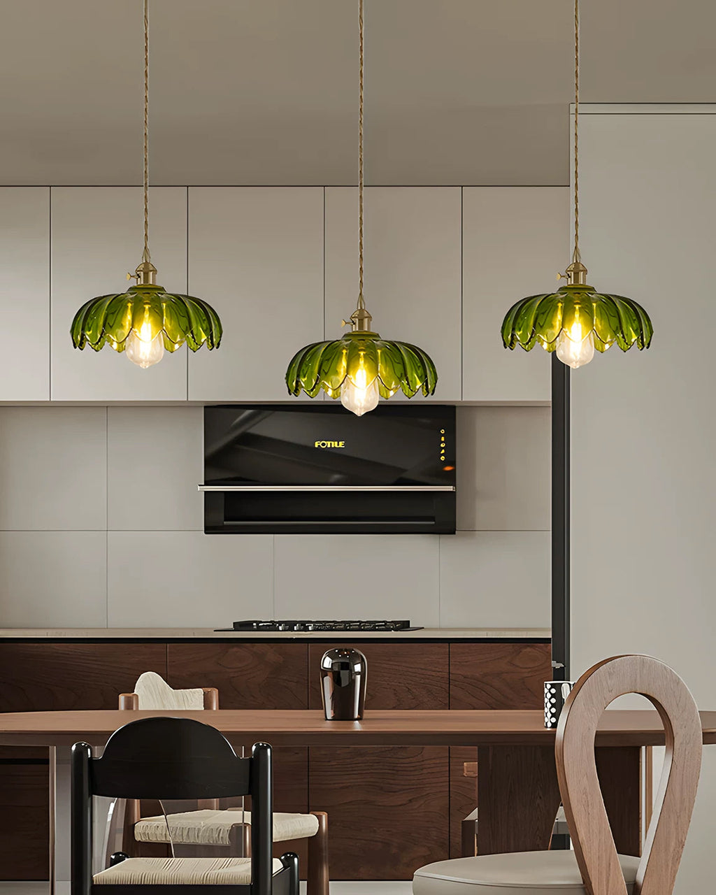 Three-shade pendant light with scalloped glass shades and brass-tone ceiling bar