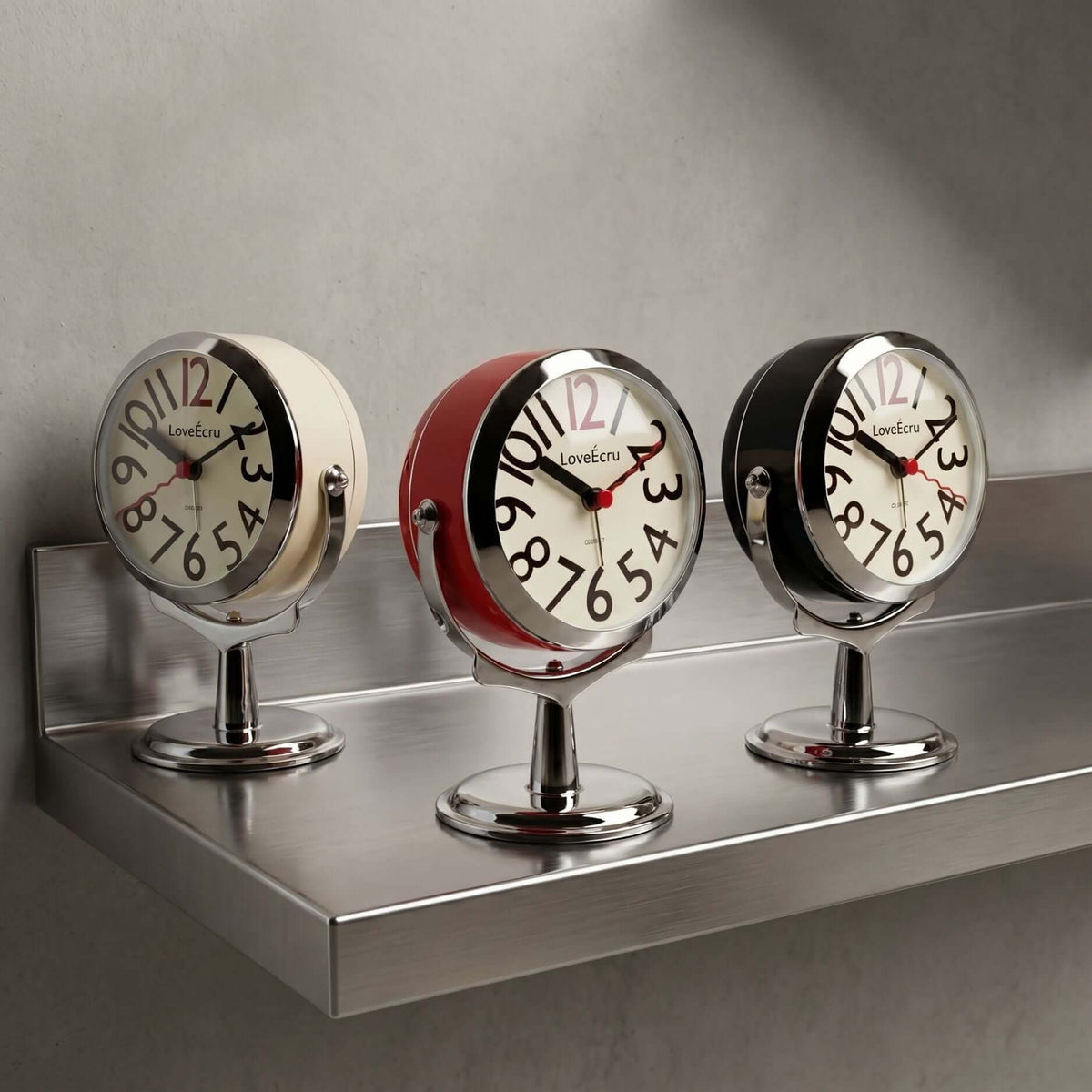 Freestanding analogue alarm clock with bold numbered dial and chrome effect stand