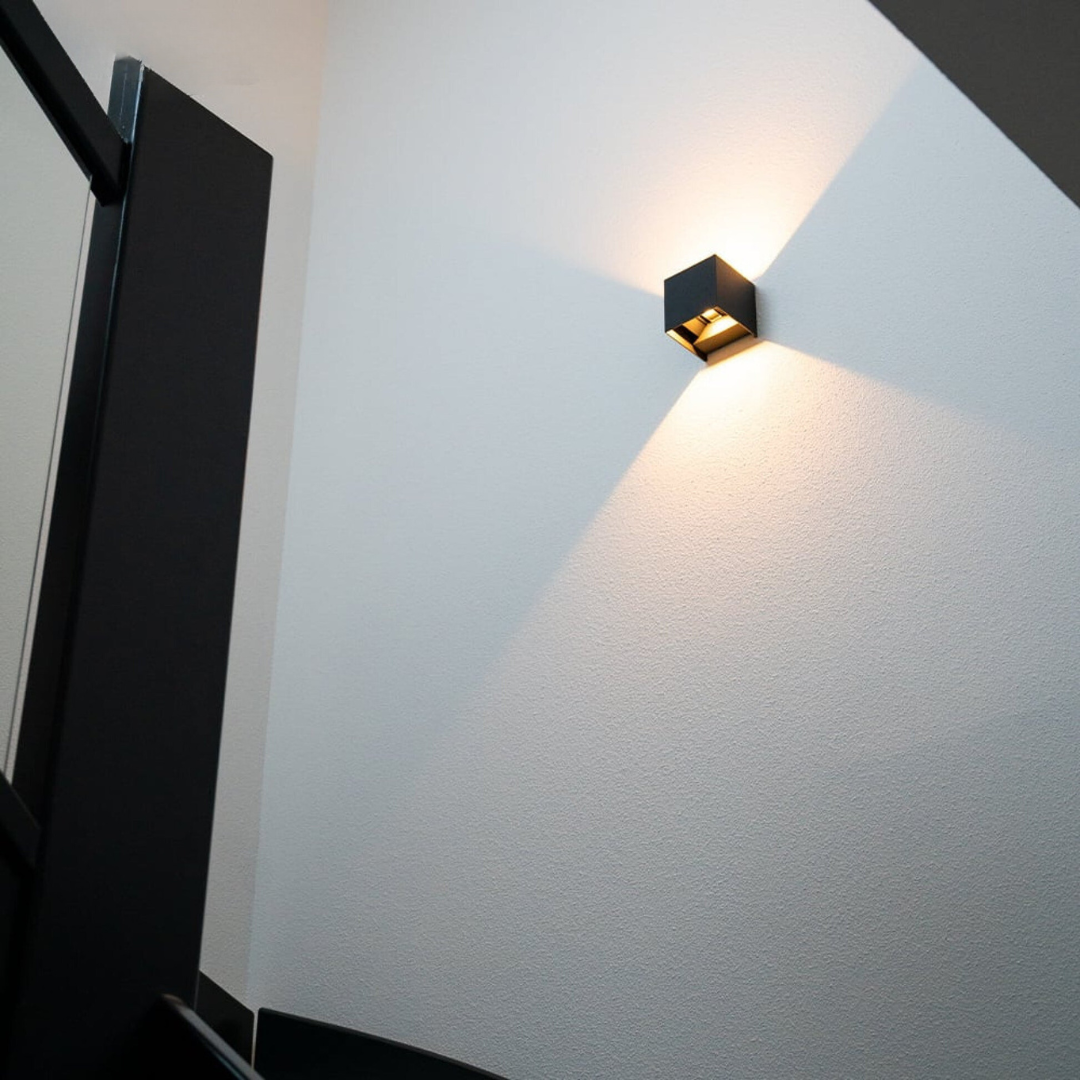Geometric LED wall light projecting light upwards and downwards