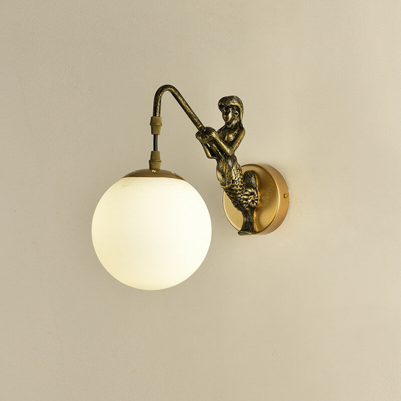 Decorative mermaid wall sconce with textured glass orb