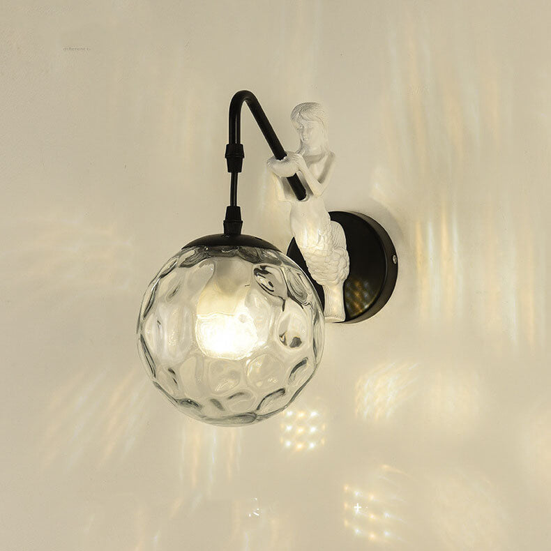 Decorative mermaid wall sconce with textured glass orb