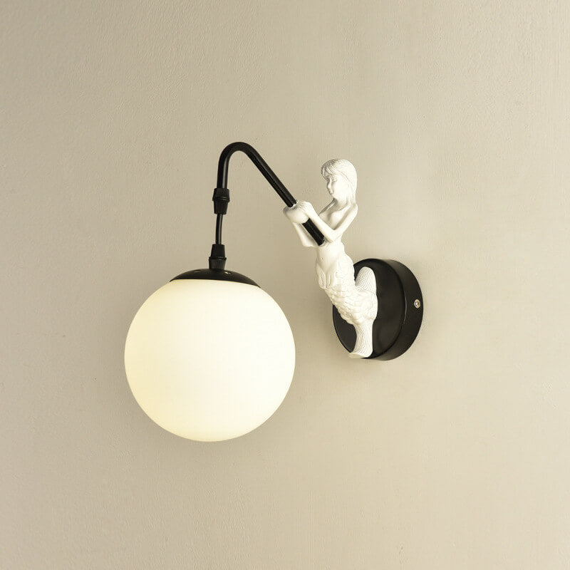 Decorative mermaid wall sconce with textured glass orb