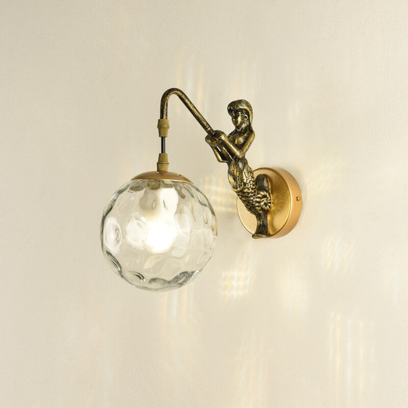 Decorative mermaid wall sconce with textured glass orb
