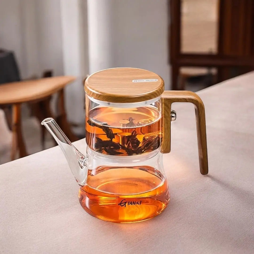 Clear glass teapot with magnetic tea chamber and wood-effect handle
