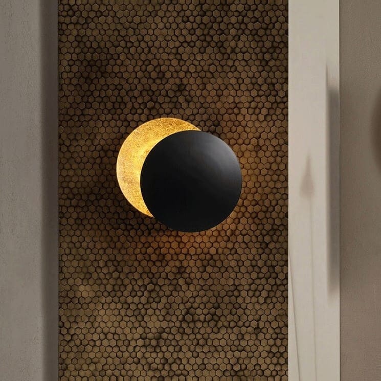 Layered circular LED wall light with an eclipse-inspired design
