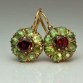 Gold-tone drop earrings with green and red faceted stones
