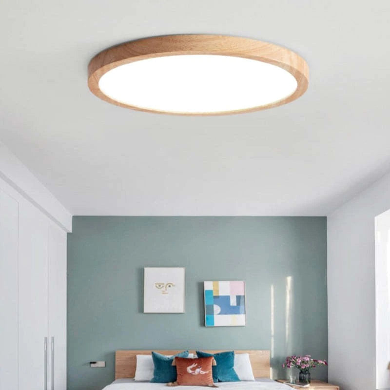 Round dimmable LED ceiling light with a light wood-effect surround