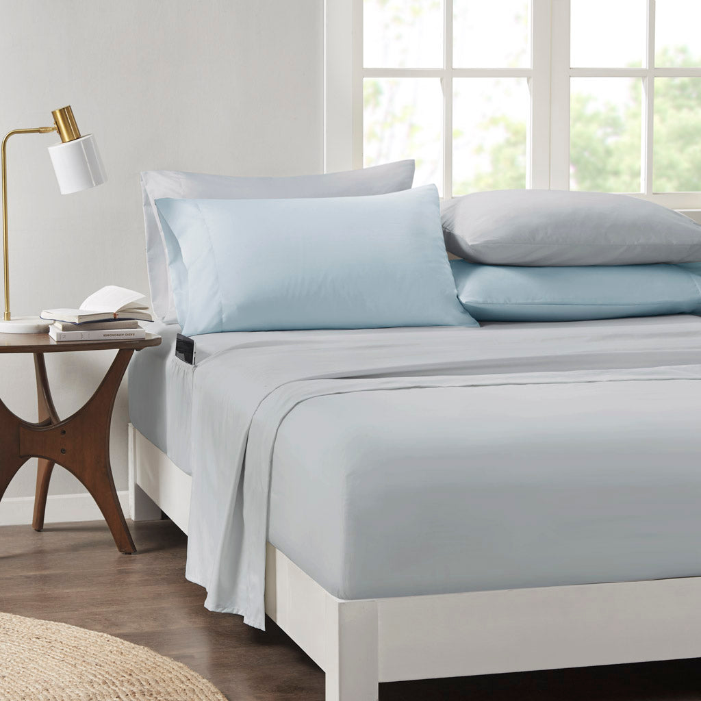 Floral comforter set with coordinating sheets and pillowcases on a bed